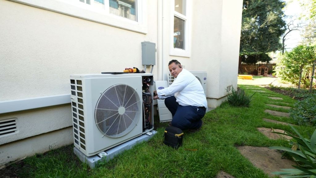 Technician repairing broken A/C